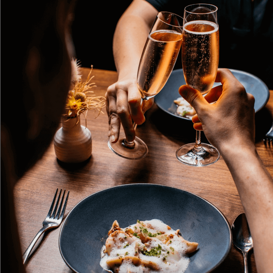 couple clicking Champagne glasses 