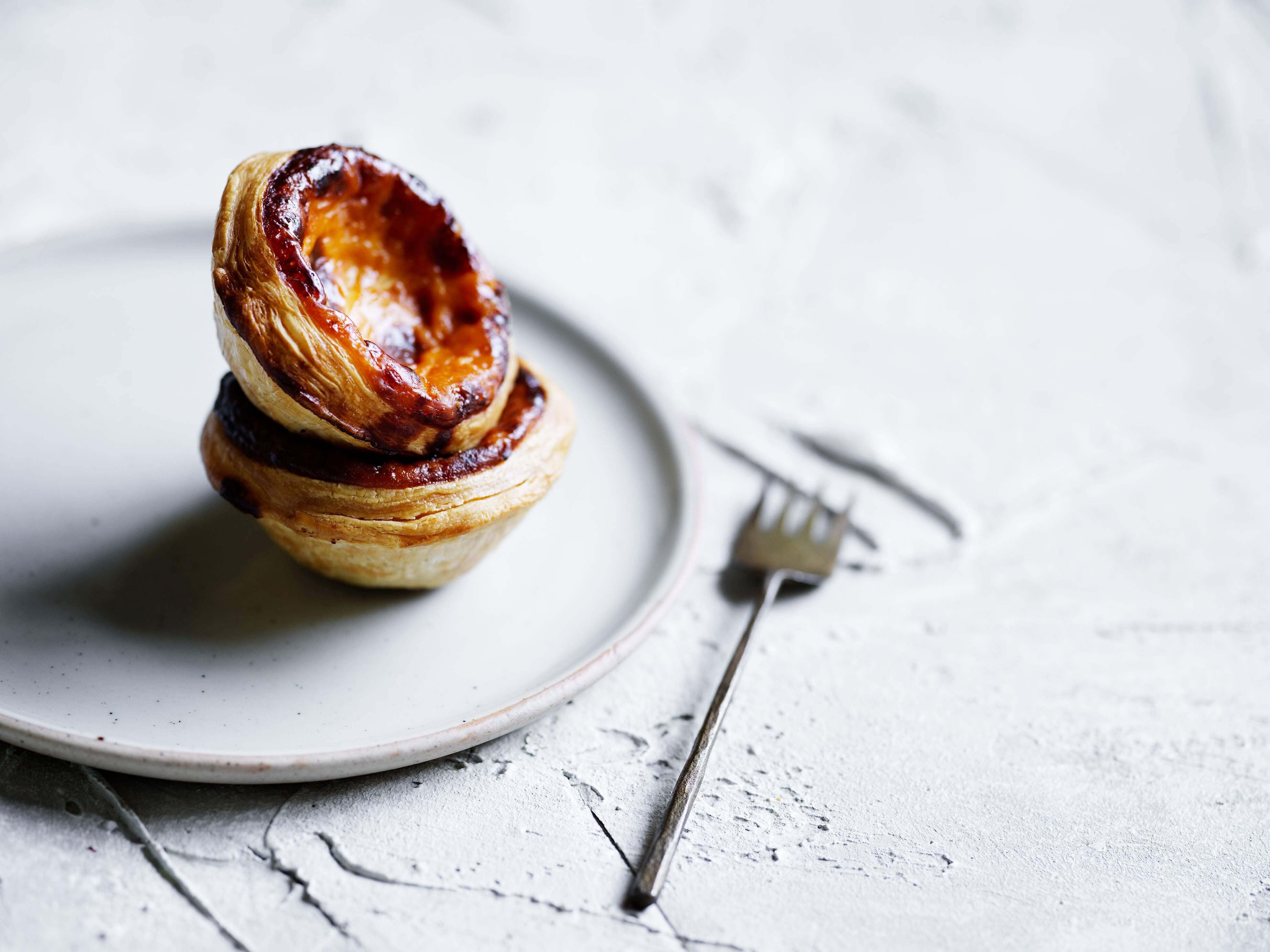 pastel de nata pastries on a plate looking delicious