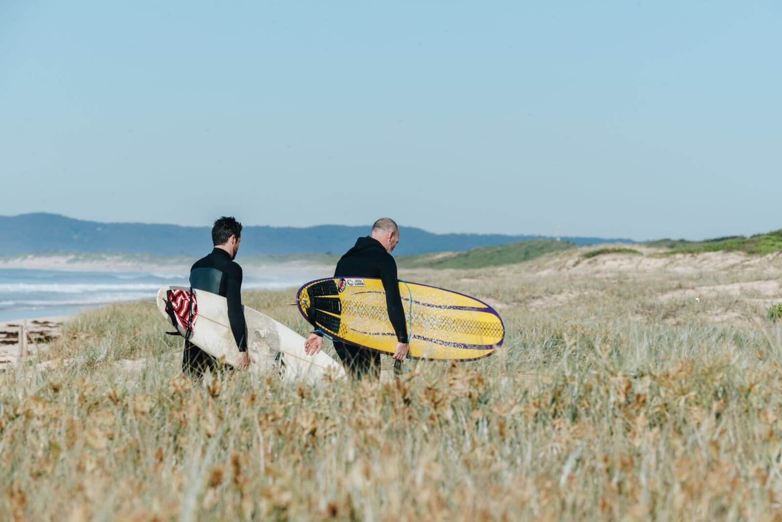 surfers using beach respectfully