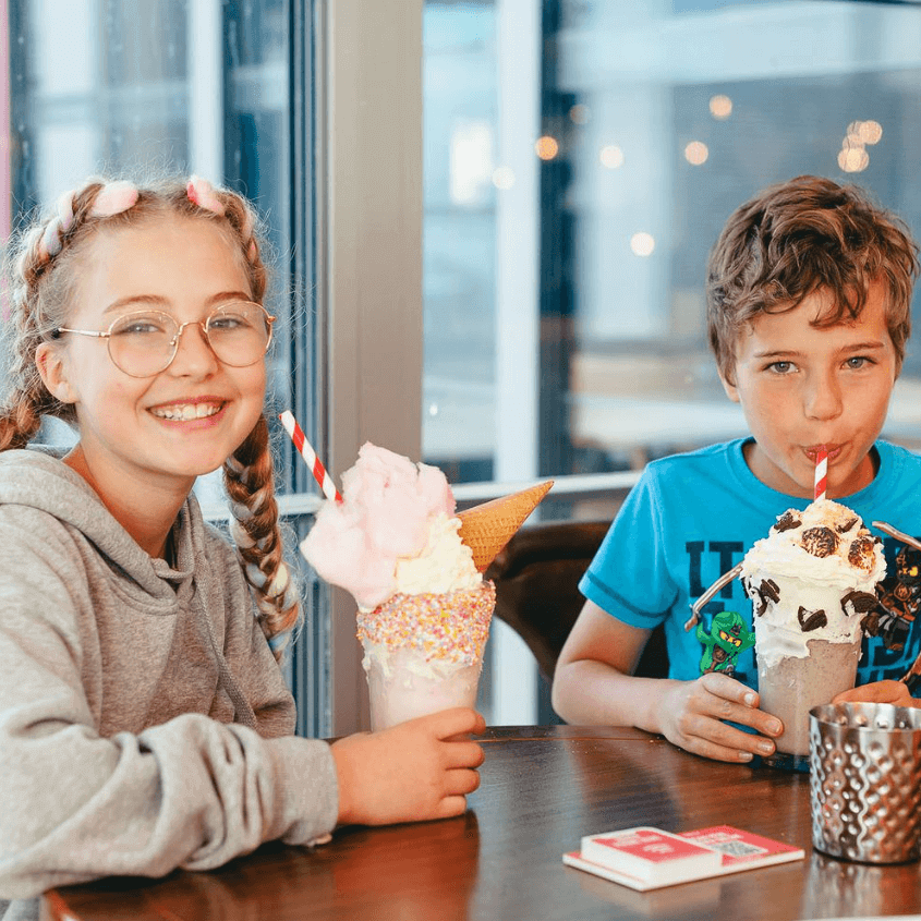 kids with crazy shakes with Kids eat free at TGI Fridays