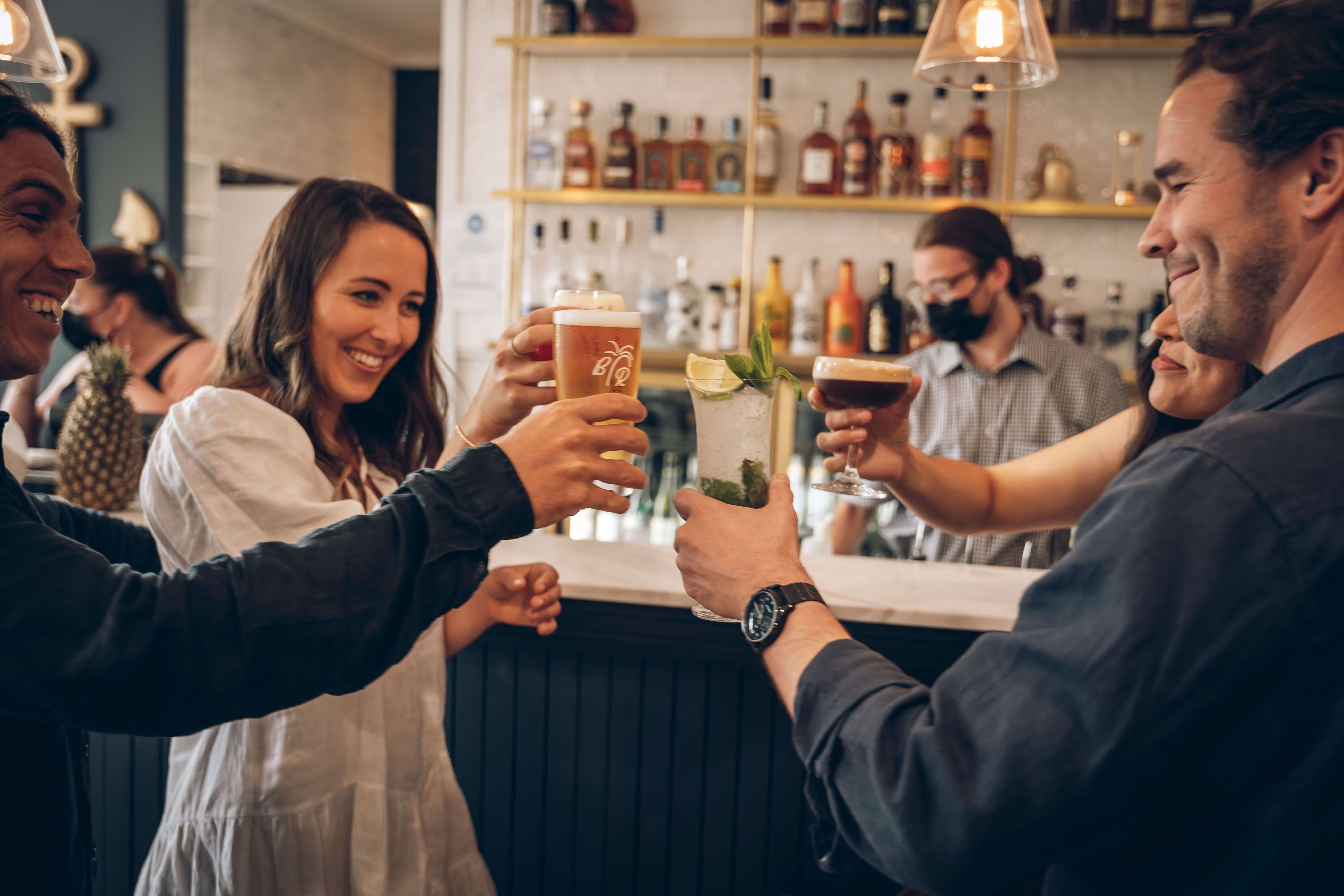 happy people toast in modern social bar