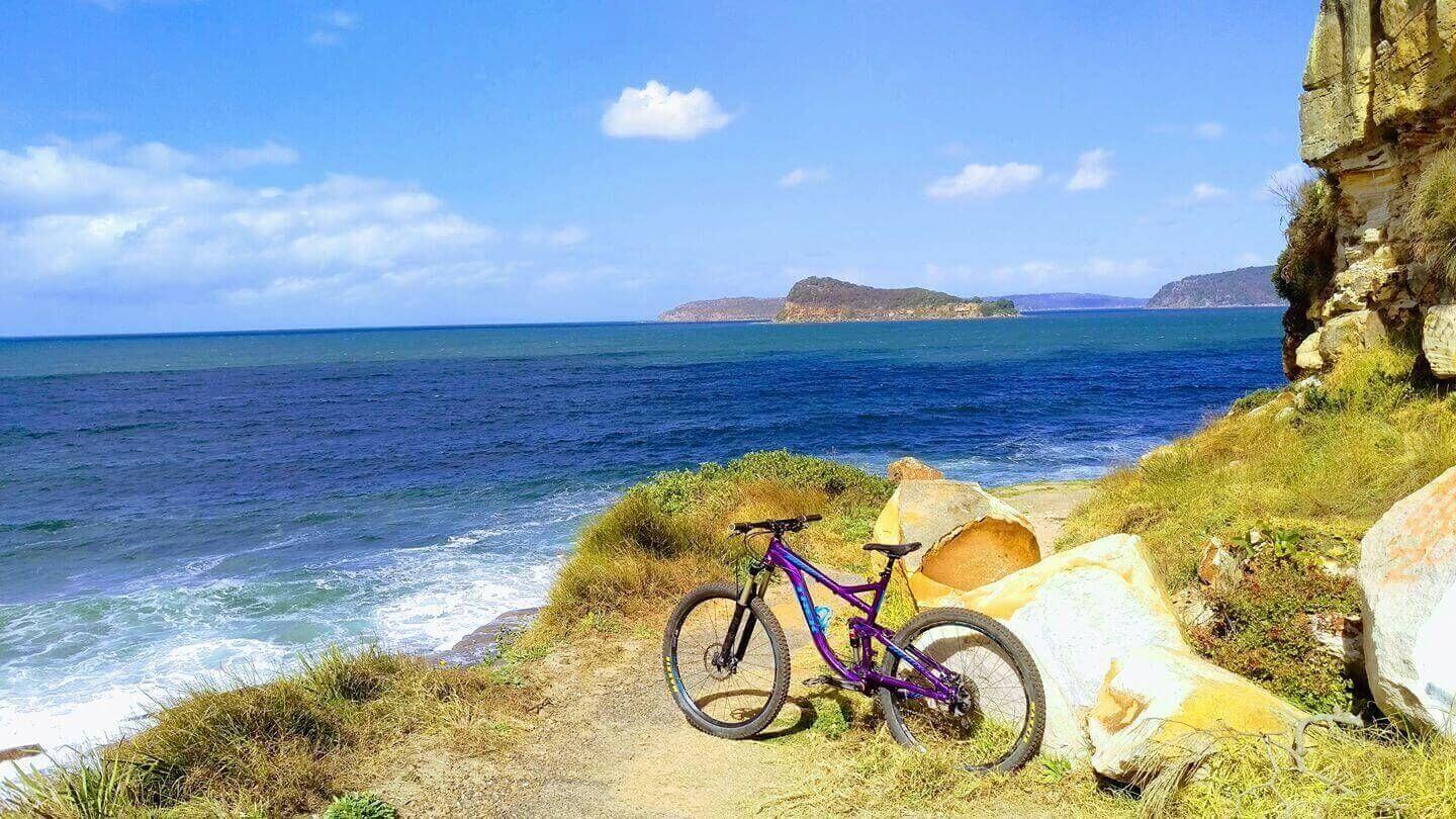 mtb on edge of lookout at broken bay