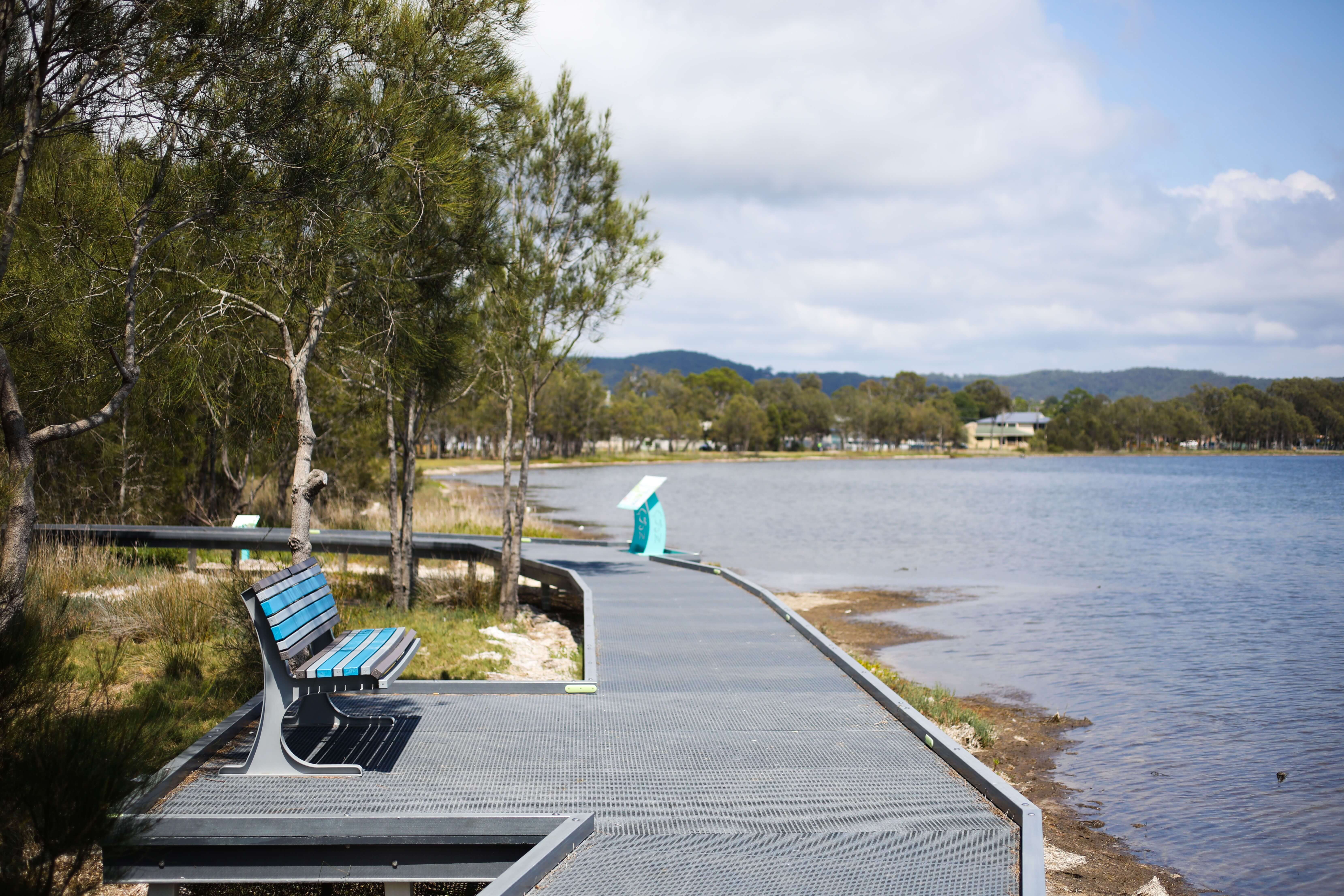 Tuggerah Lakes viewing deck with chair looking over the lake