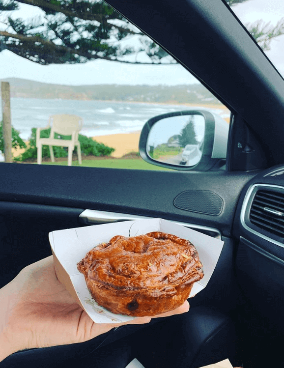 pie in hand in car