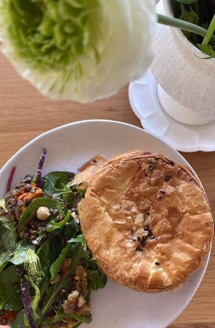 veggie pie on plate with salad