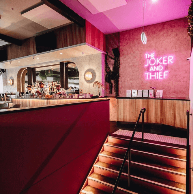 bright pink neon sign in restaurant venue