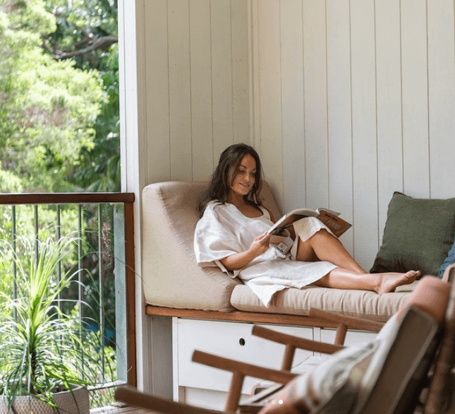 woman relaxing with book