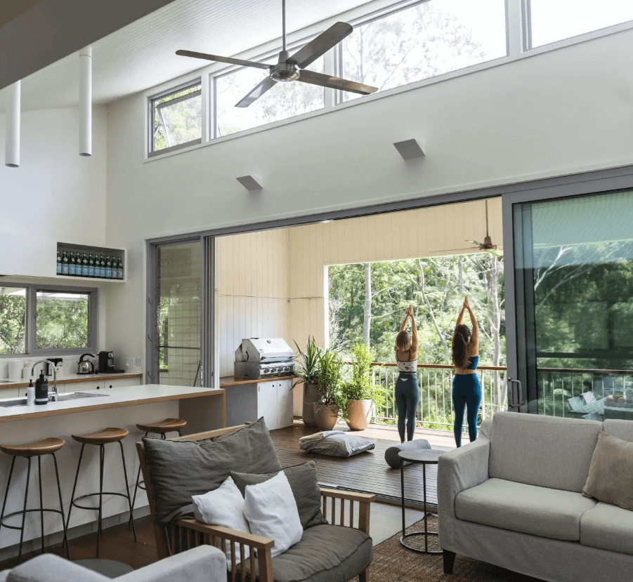 women doing yoga in large pavilion home