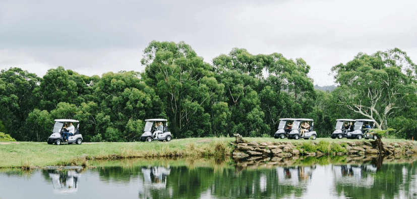 golf carts along lake