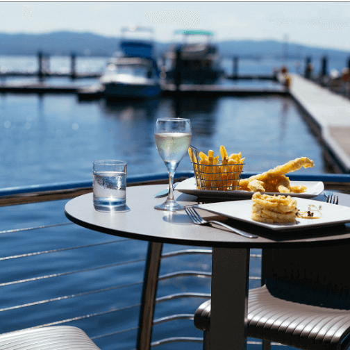 fish and chips and two glasses of wine on the deck