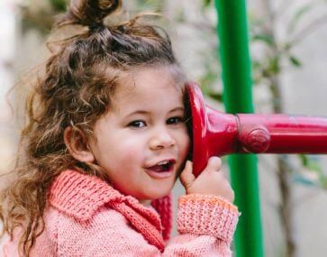 young girl at interactive playground 