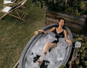 Growers Cottage women in outdoor bath