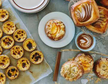 table covered with fresh baked pastries