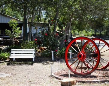 red cannon wheels and bench