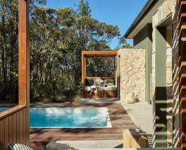 The Lodges from Bells at Killcare outside entertainment area overlooking a private pool.