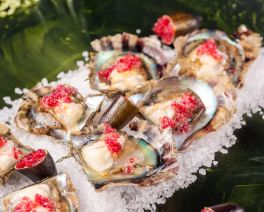 akoya pearl oysters on a platter with garnish