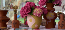 handmade pots of flowers with ying yang design