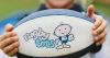 Gosford RSL Club Rugbytots. Child holding Rugbytots football.