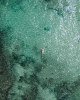 woman floating on turquoise water