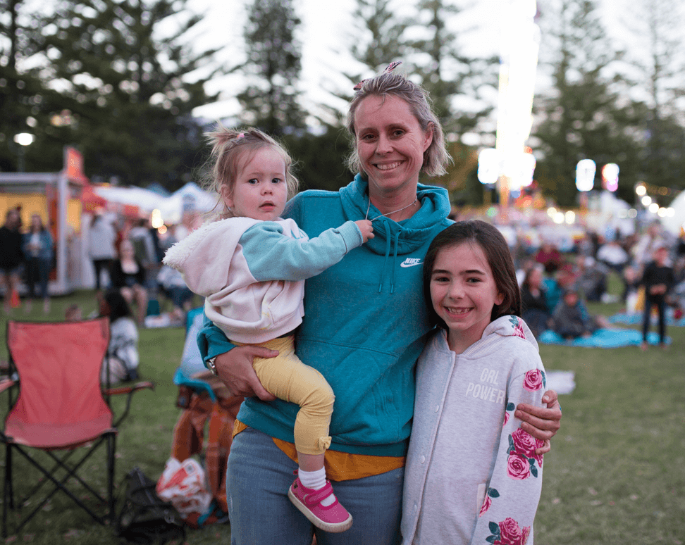women and two kids at festival